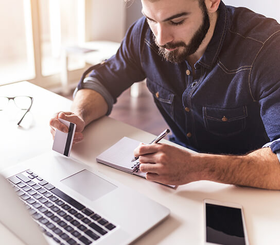 man paying a bill online